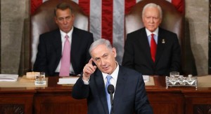 FILE - In this March 3, 2015, file photo, Israeli Prime Minister Benjamin Netanyahu gestures as  he speaks before a joint meeting of Congress on Capitol Hill in Washington. House Speaker John Boehner of Ohio, left, and Sen. Orrin Hatch, R-Utah, listen. Relations between President Barack Obama and congressional Republicans have hit a new low. There has been little direct communication between Obama and the GOP leadership on Capitol Hill since Republicans took full control of Congress in January. Obama has threatened to veto more than a dozen Republican-backed bills. And Boehner infuriated the White House by inviting Netanyahu to address Congress without consulting the administration first.  (AP Photo/Andrew Harnik, File)