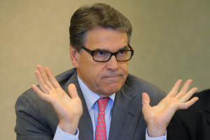 Texas Governor Rick Perry, a possible Republican candidate for the 2016 presidential race, answers a question about his indictment in Texas on two felony counts of abuse of power during an appearance at a business leaders luncheon in Portsmouth, New Hampshire August 22, 2014.   REUTERS/Brian Snyder  (UNITED STATES - Tags: POLITICS CRIME LAW BUSINESS)