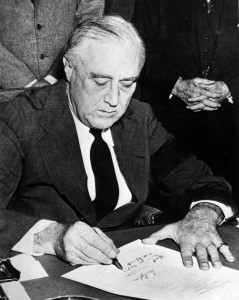 President Franklin D. Rossevelt signing the declaration of war against Japan, December 8, 1941.  (National Park Service) NARA FILE #:  079-AR-82 WAR & CONFLICT BOOK #:  743