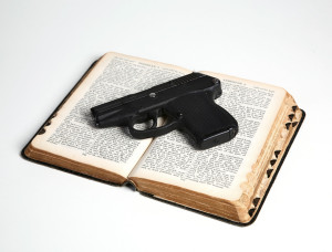 Pistol on Open Bible