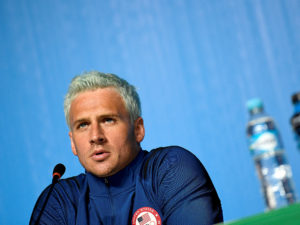US swimmer Ryan Lochte holds a press conference on August 3, 2016 in Rio de Janeiro, two days ahead of the opening ceremony of the Rio 2016 Olympic Games. / AFP / Martin BUREAU        (Photo credit should read MARTIN BUREAU/AFP/Getty Images)
